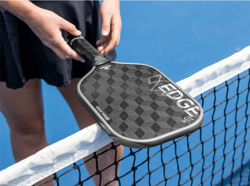 Player holding Diadem Edge 18k Speed Pro Pickeball Paddle