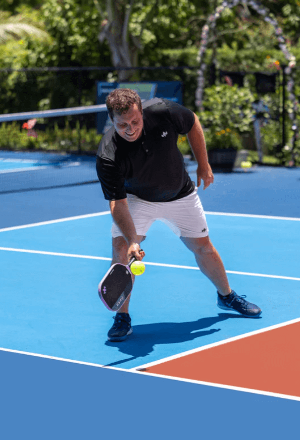 Male hitting with a Diadem Hush Pickleball Paddle