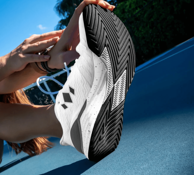 Pickleball players stretching with Diadem Court Burst Shoes