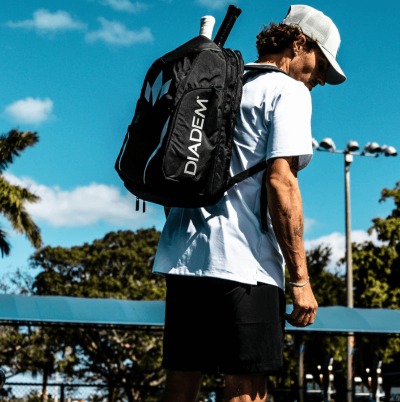 Vulcan Tour V3 Pickleball Backpack and player on court