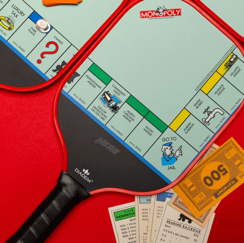 Diadem Monopoly Pickleball Paddles with game pieces