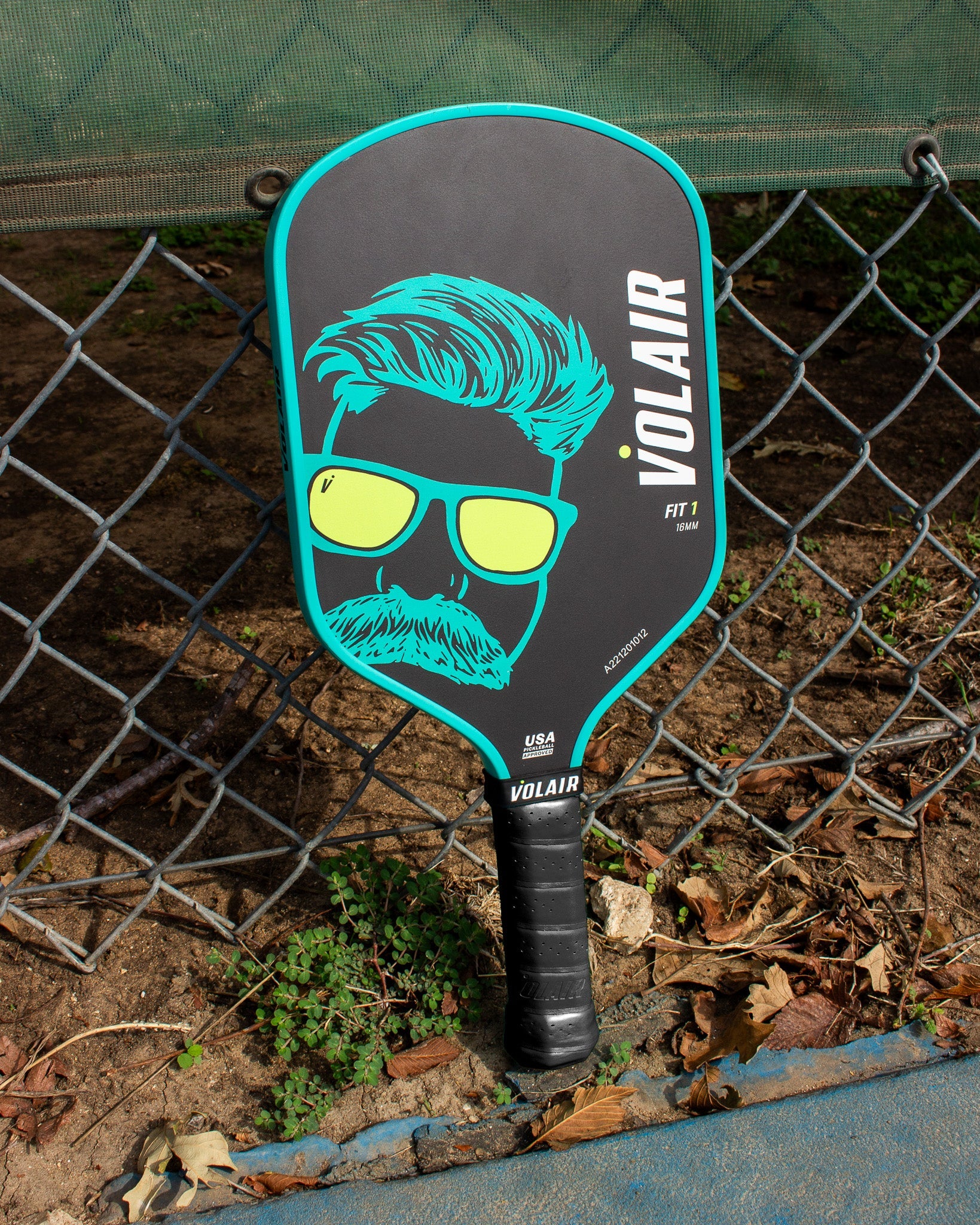 Volair Fit 1 Limited Edition Pickleball Paddle on fence