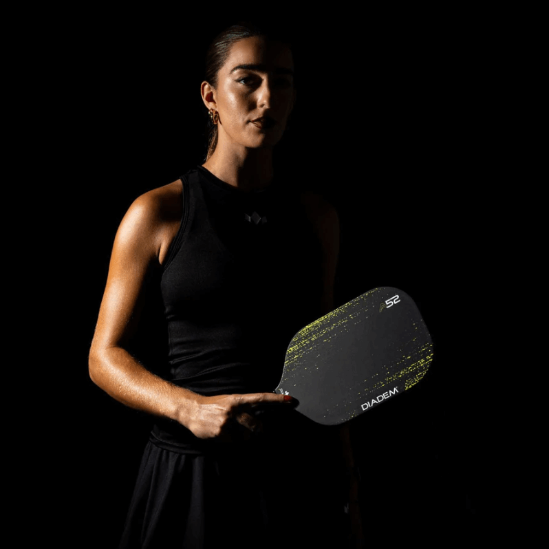 Pickleball player holding Diadem A52 paddle