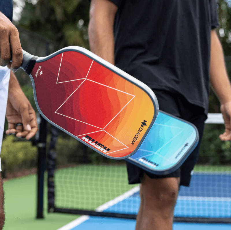 Pickleball players holding Diadem Rush paddles