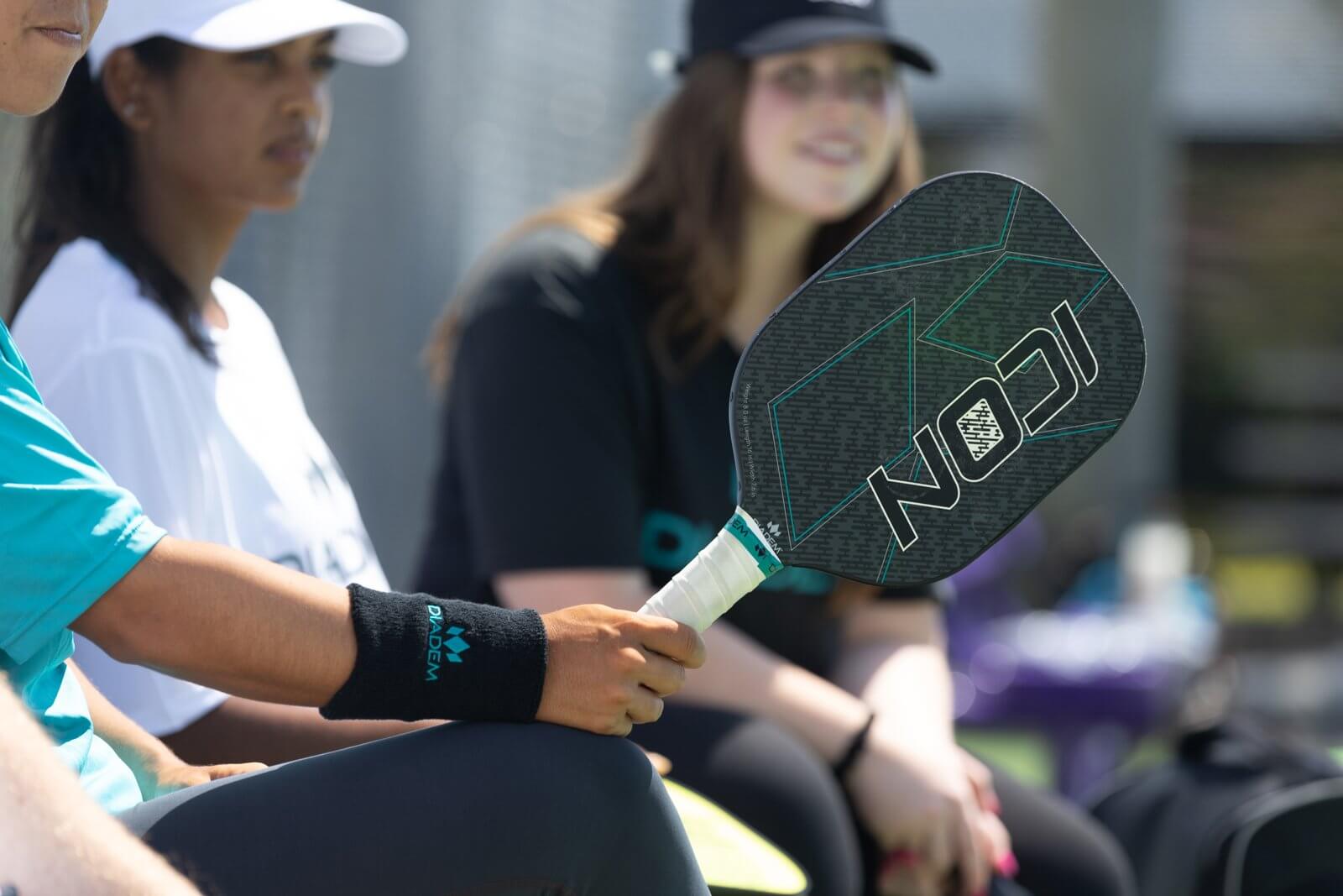 Diadem Icon Black Pickleball Paddle in Hand